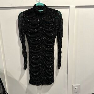 Worn only once!! Black ruched dress with sheer sleeves.